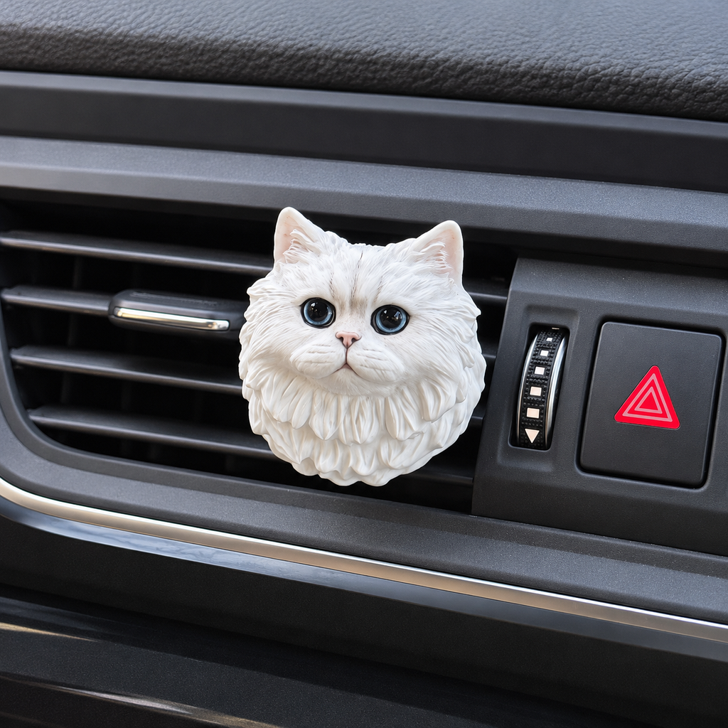 Close-up of white cat aroma stone car vent ornament