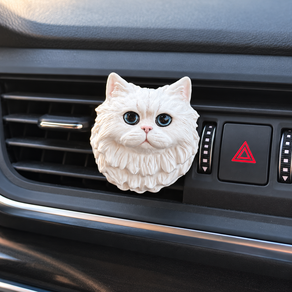 White cat aroma stone ornament clipped to car air vent, styled product view